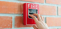 Hand on Fire Alarm